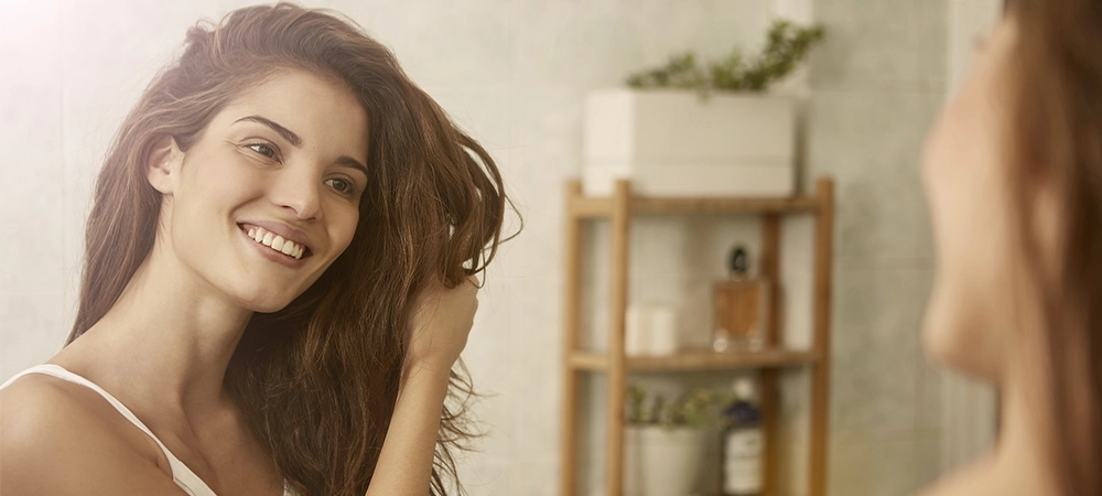 Healthy hair self-care routine with shampoo, conditioner, hair mask, gentle brushing, heat protection, and simple hair care tips